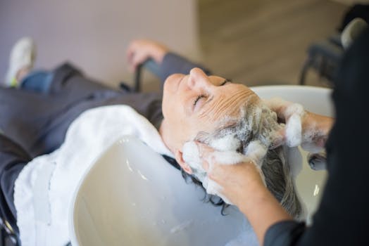 Woman having her hair shampooed in a salon